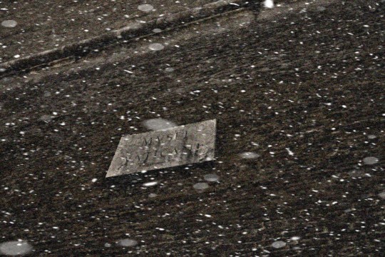 Input image affected by low light and snow